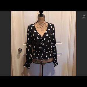 Polka dot lace up front blouse